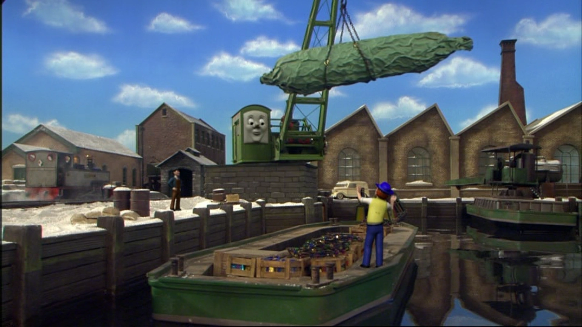 艀にクリスマスツリーを積み込んでいるコリン