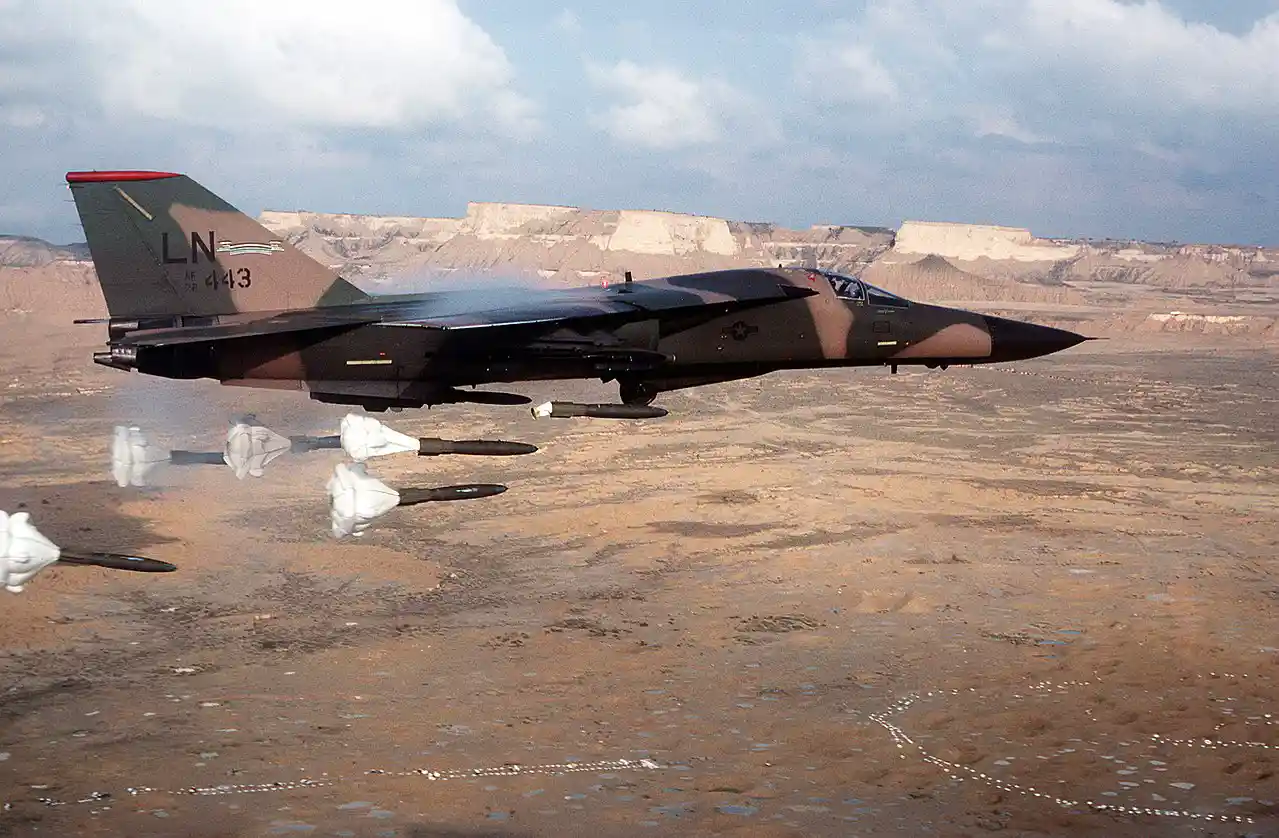 1280px-F-111F_dropping_high-drag_bombs.jpg