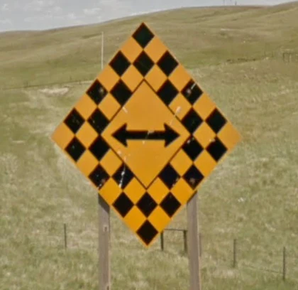 canada-yellow-black-sign.png