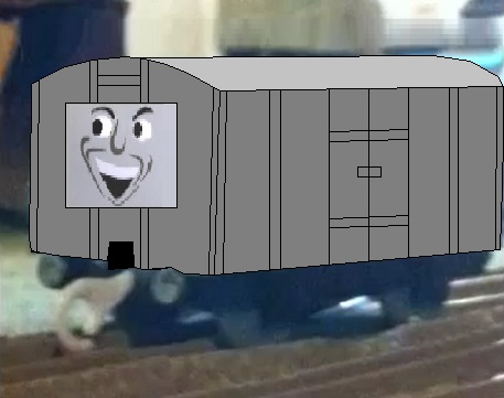 灰色の前向き顔有りの小型有蓋貨車（タイプ１）